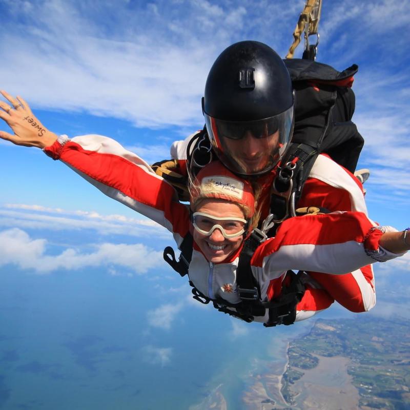 a man flying through the air while riding skis