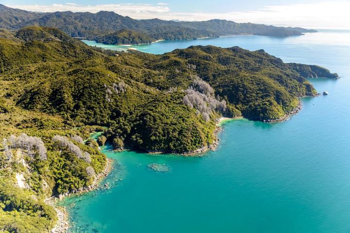 a body of water with a mountain in the background