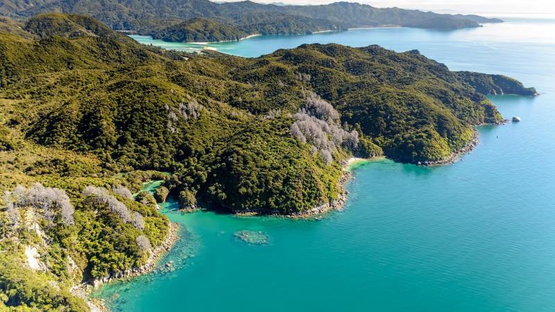 a body of water with a mountain in the background