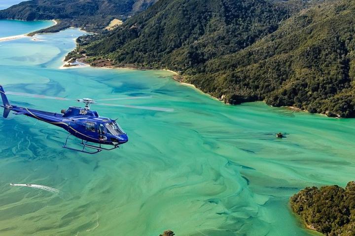 a large body of water with a mountain in the background