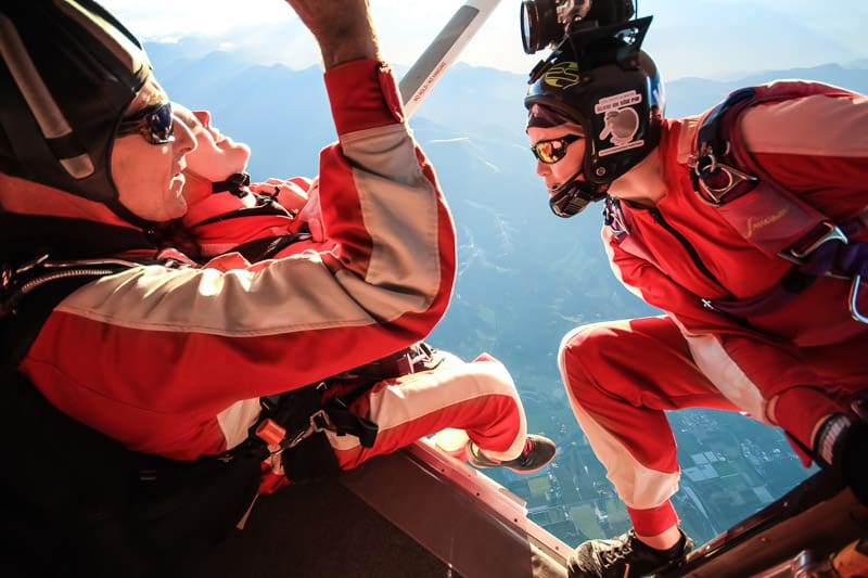 a group of people riding skis on a snowy slope