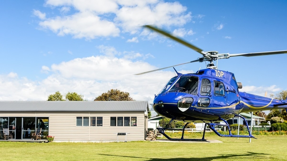 chopper a helicopter parked in a field