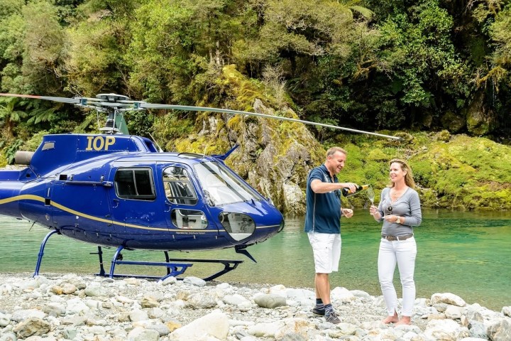 a person standing next to a boat
